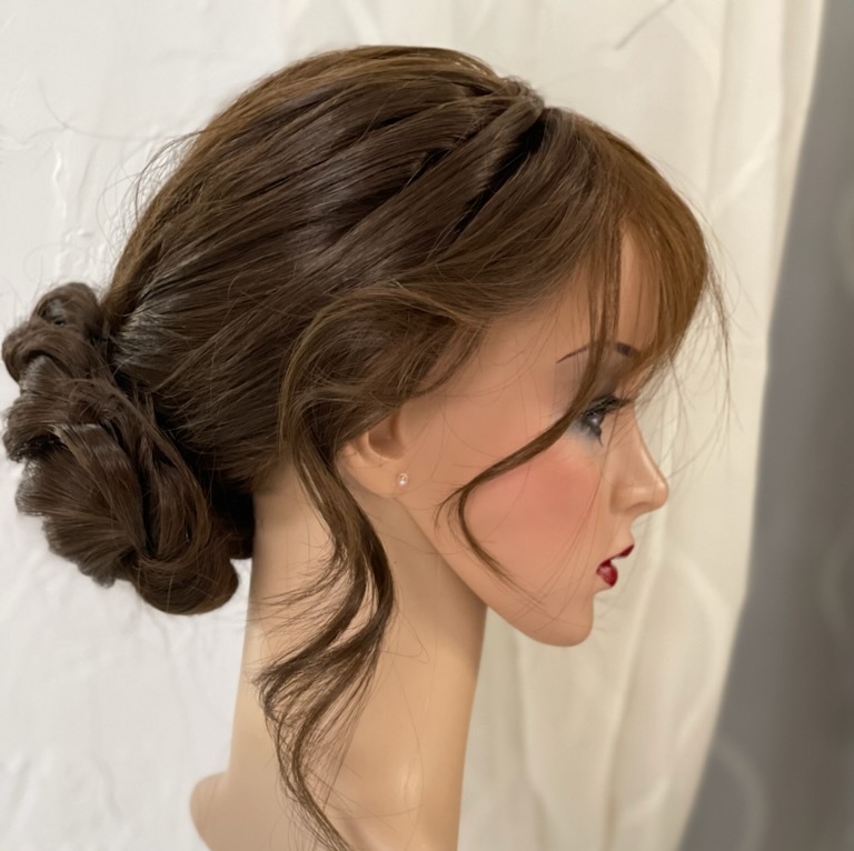 Wedding updo on her piece resdy for the client to wear. 3/4 Topper. She has two pieces which she can quickly "change" into to give her the desired look.